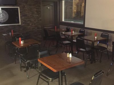 Tables and chairs inside deli